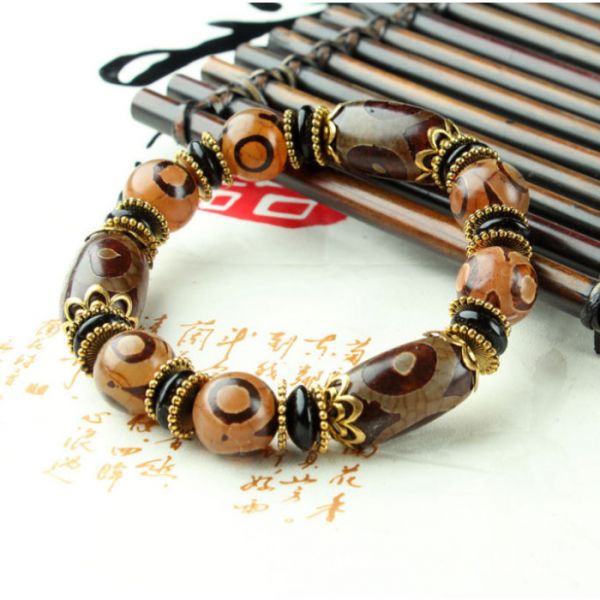 Браслет дев'ять коричневих триоких ДЗИ